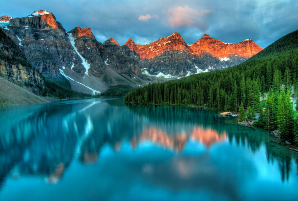 pexels-photo-417074-417074 Capture the serene beauty of Moraine Lake with sunrise reflections in Banff National Park.